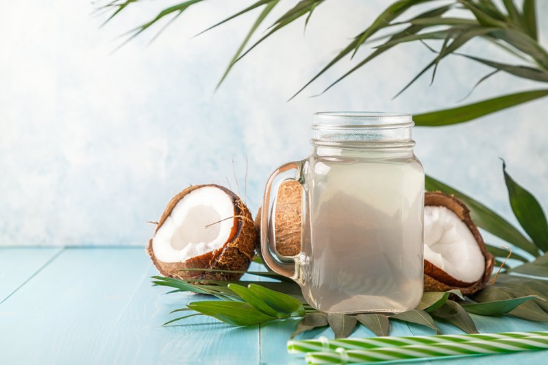 coconut-water-and-coconuts-on-a-bright-pastel-back-2023-11-27-05-36-25-utc