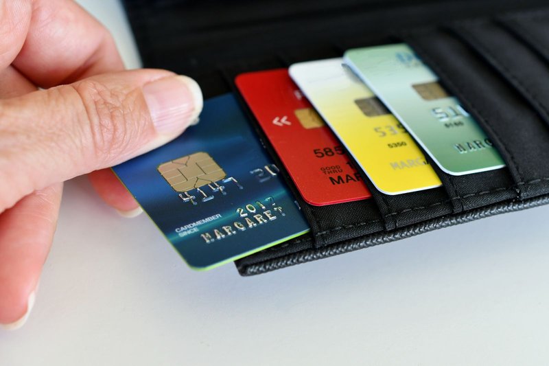 credit-cards-pulling-a-credit-card-out-of-wallet-2022-08-01-04-12-18-utc
